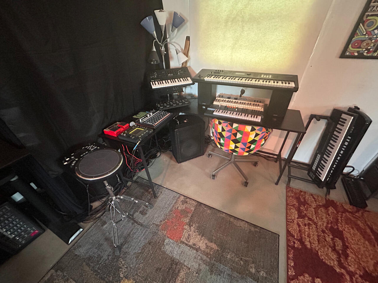 Synth and electronic station with keyboards, drums, and looper